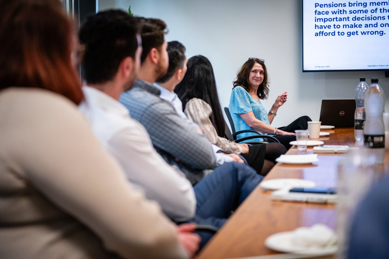 Laura Catterick leading discussion amongst colleagues in investment meeting | Mobius