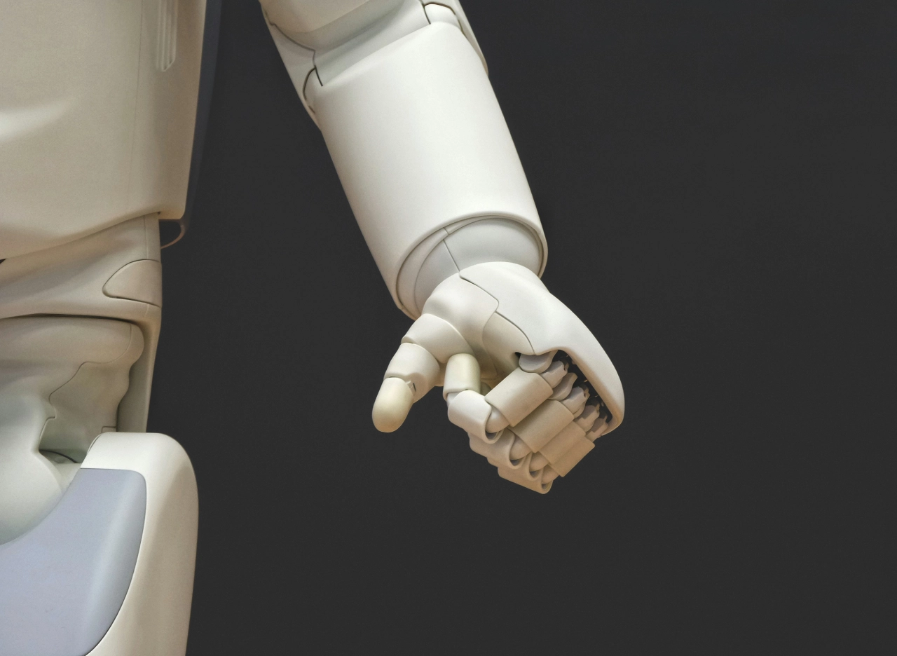 Humanoid robot with clenched left hand | Mobius